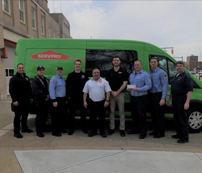 Our marketing rep, Mike, standing with 8 members of the Pawtucket Fire Department, including the chief 